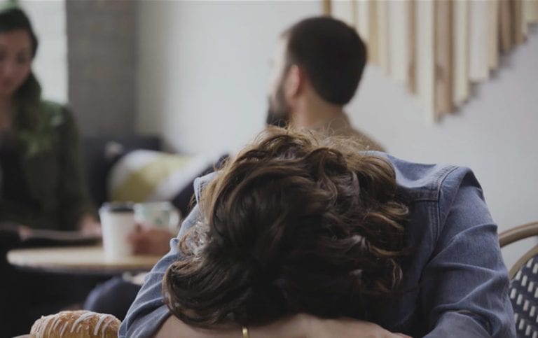 Girl with her head on a desk